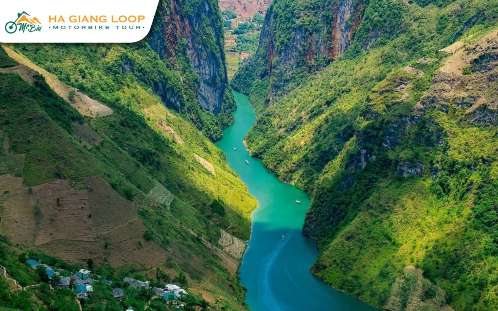 Glide along emerald waters through Tu San Canyon on the serene Nho Que River