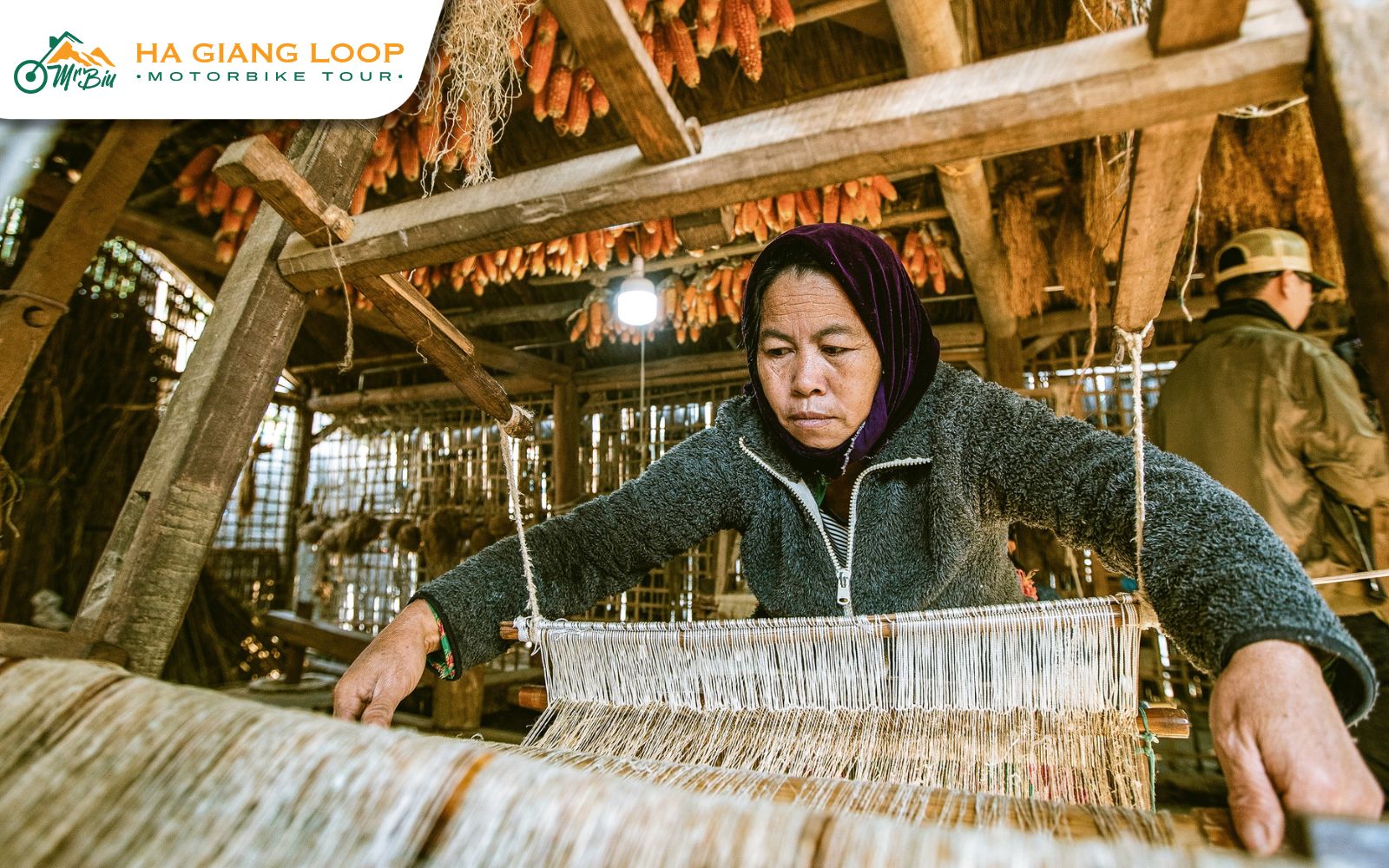 Skilled hands guide threads across traditional weaving frames