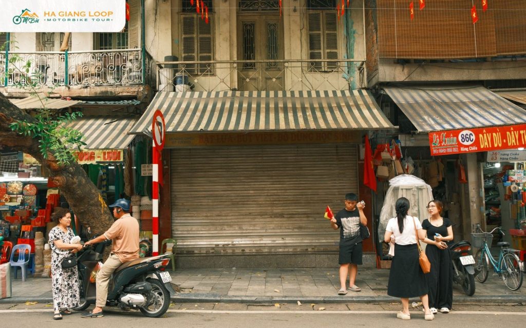 Street scene with a motorbike and shopfronts in a Vietnamese town