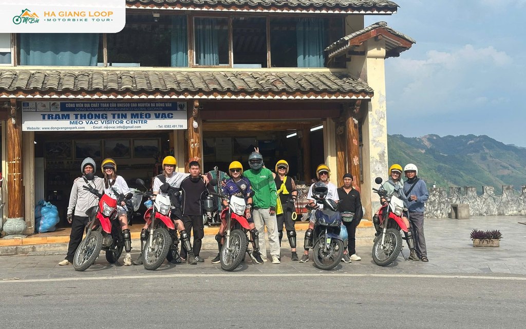 Mr. Biu group with their bikes outside the Meo Vac visitor centre