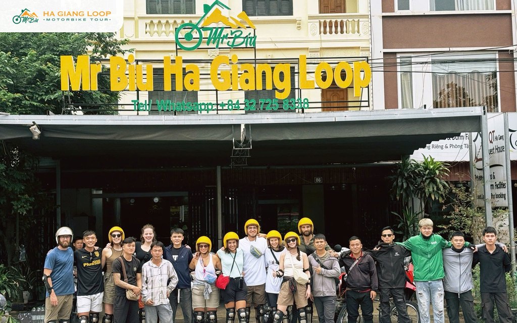Large group of self-drivers, easy rider guests and drivers outside the Mr. Biu office