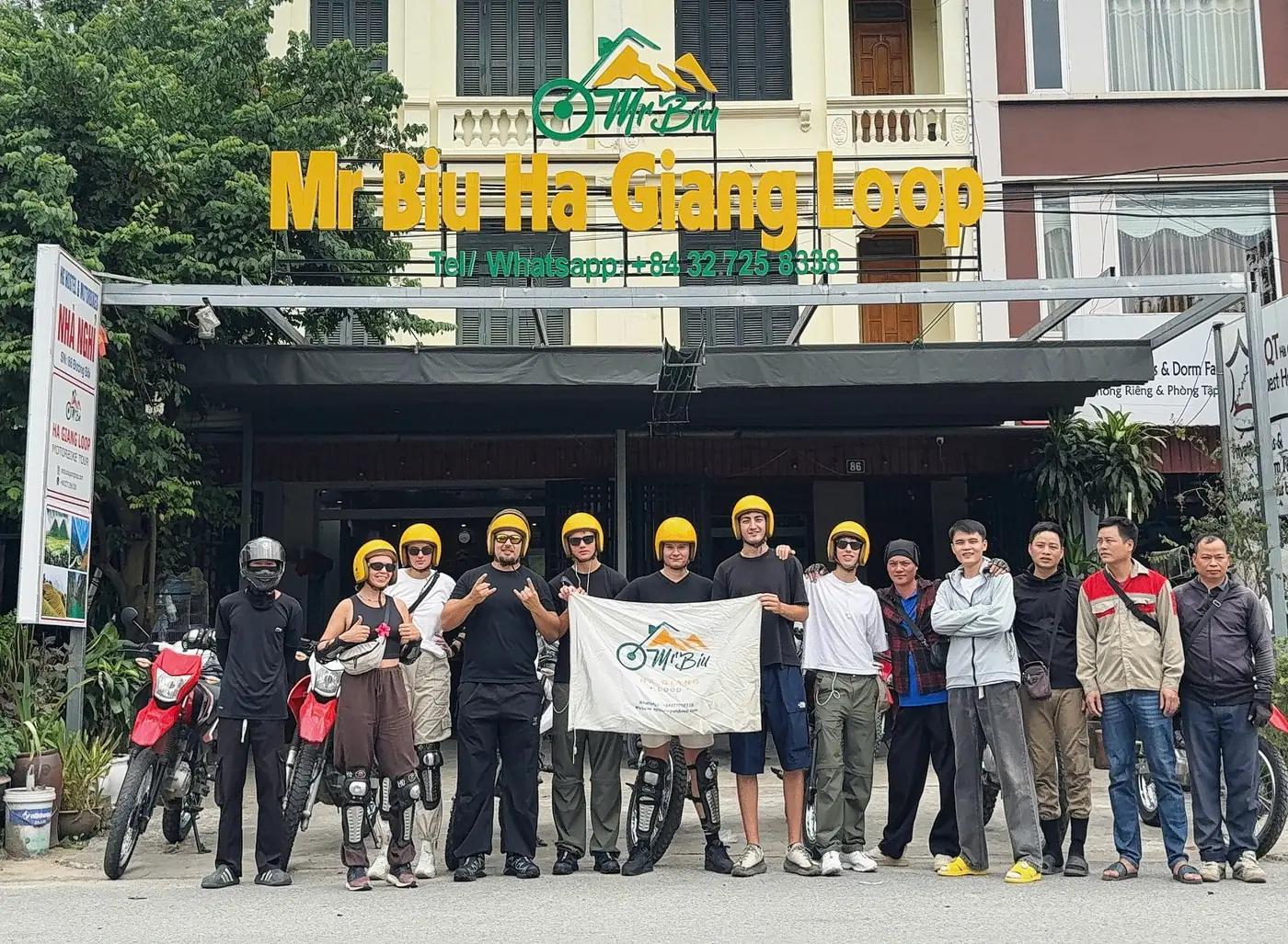 Mr Biu tour group in front of the Mr Biu Ha Giang Loop office