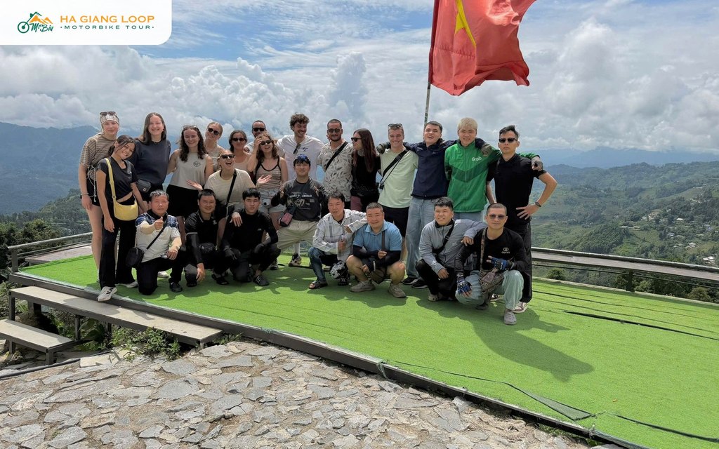 Mr. Biu tour group at a viewpoint with the Vietnamese flag