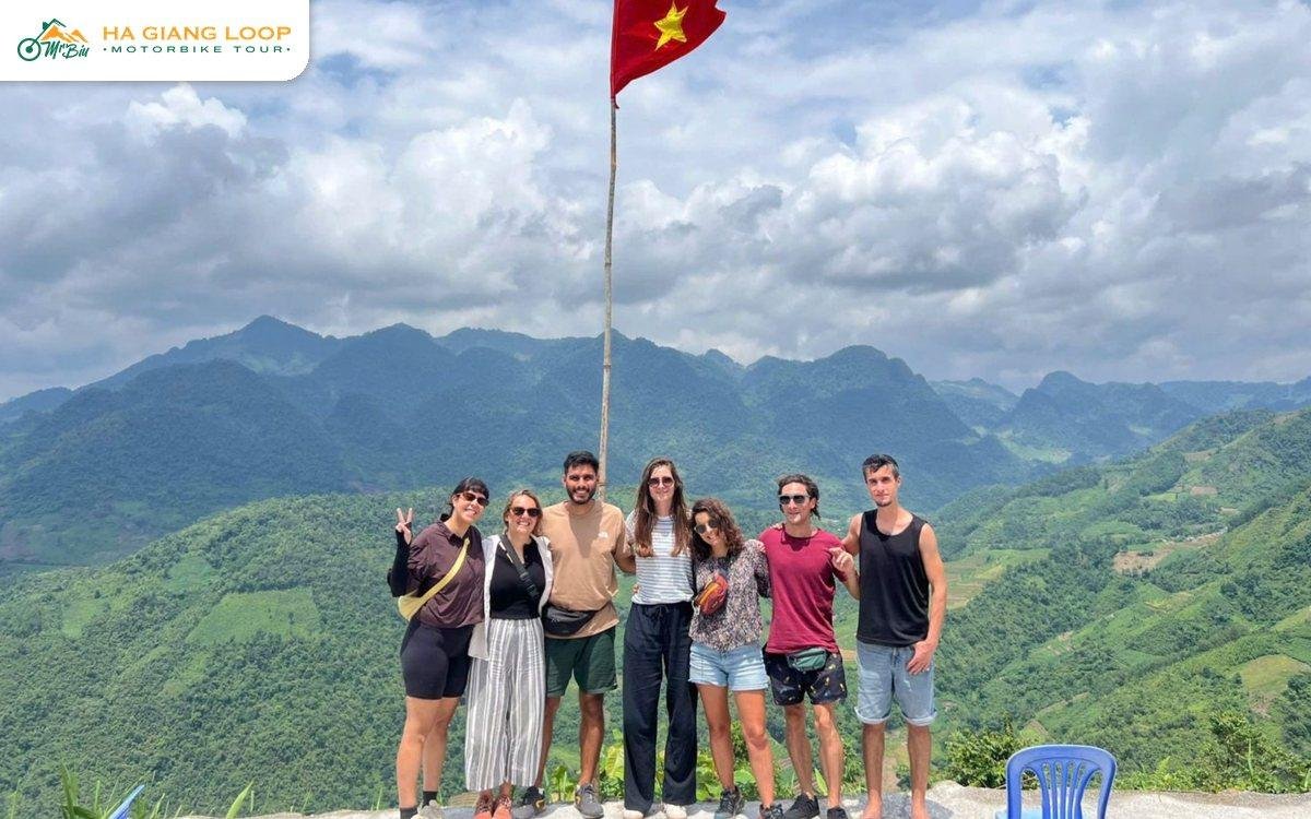 Riders at a viewpoint on the day one route over Thai An Pass