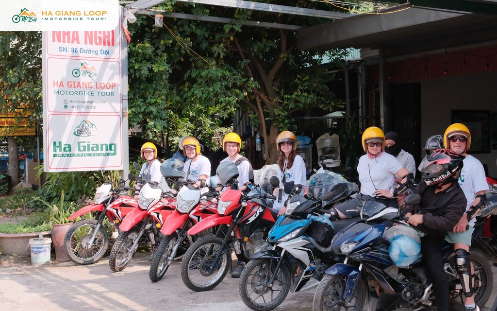Riders on their bikes outside the Mr. Biu office in Ha Giang city